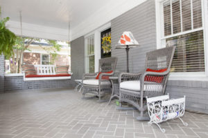 Updating the porch’s tile floor with brick pavers in a more modern herringbone pattern was among the couple’s earlier home-improvement projects.