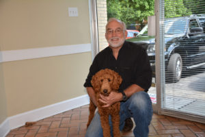 Brad Cruickshank with his dog, Pepper.