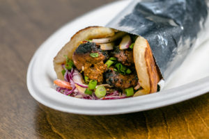 The Masala Tri-tip Roll is spicy, with flavors of black pepper, dark soy, curry leaf, ginger garlic and vinegar.