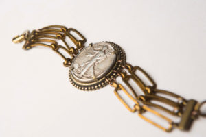 A bracelet featuring a Walking Liberty half dollar coin retails for $218.