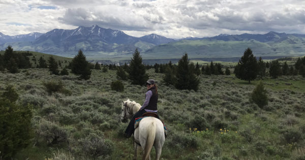 The author and her horse, Ivan, explore the ranch’s rugged landscape.