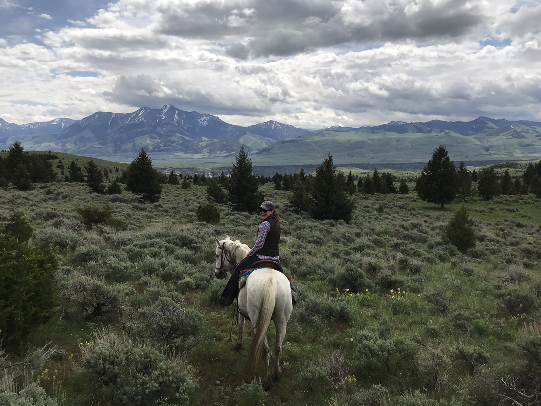 The author and her horse, Ivan, explore the ranch’s rugged landscape.